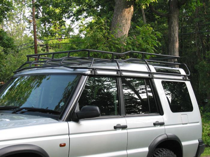 roof racks on the car roof with their hands