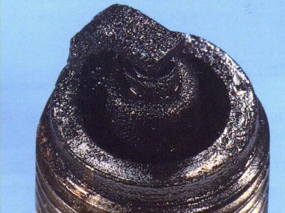 black carbon on spark plugs causes