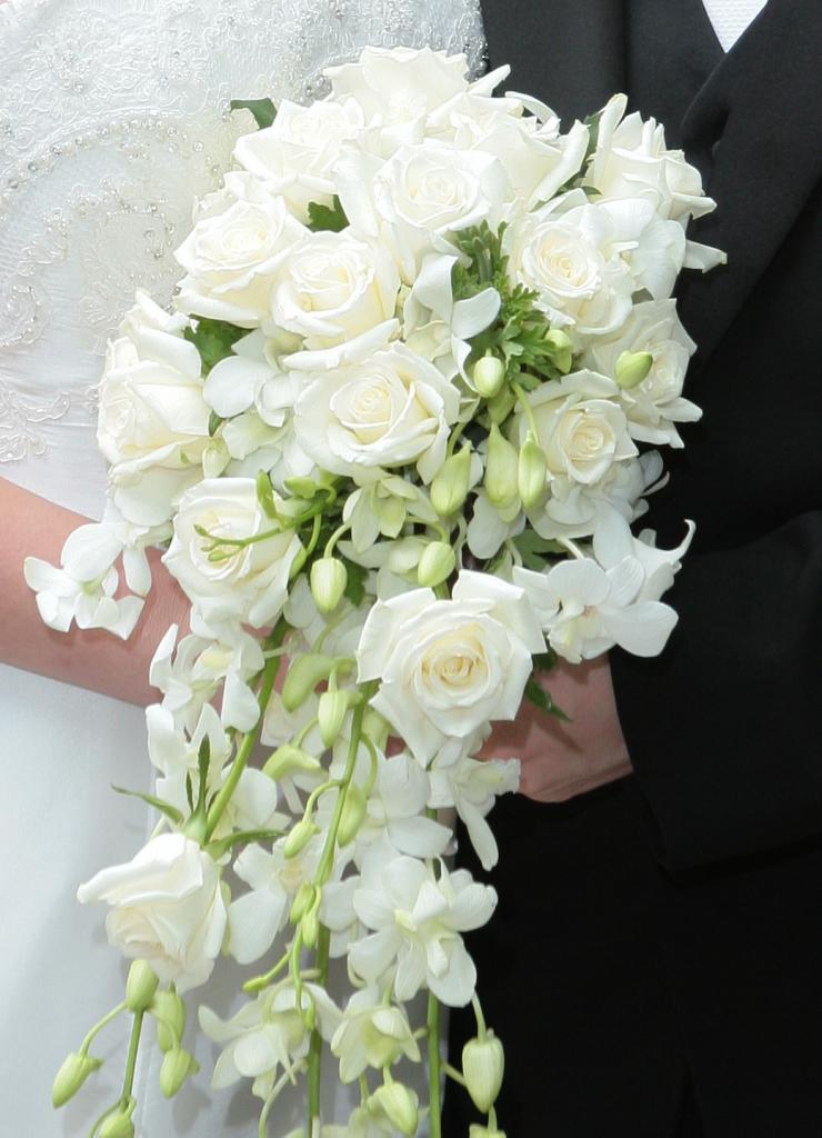 a Cascading bouquet of white roses