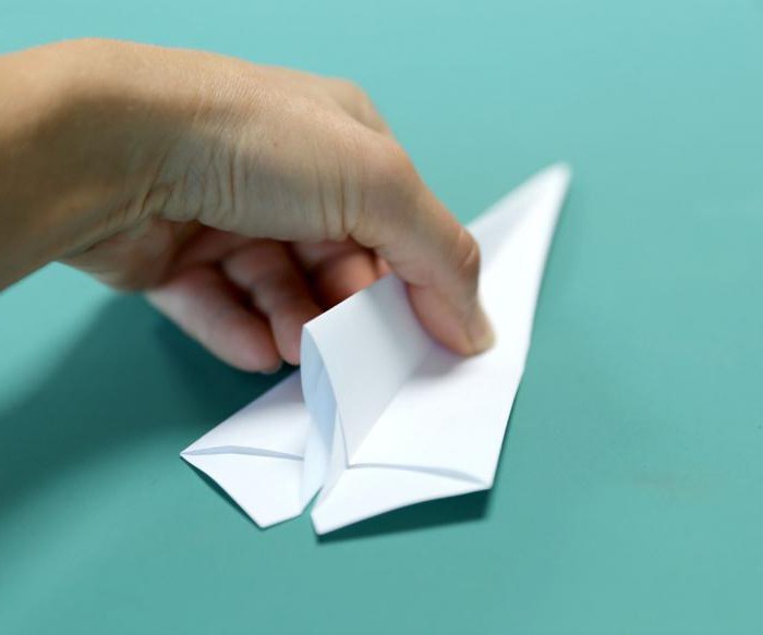 paper airplanes with their hands