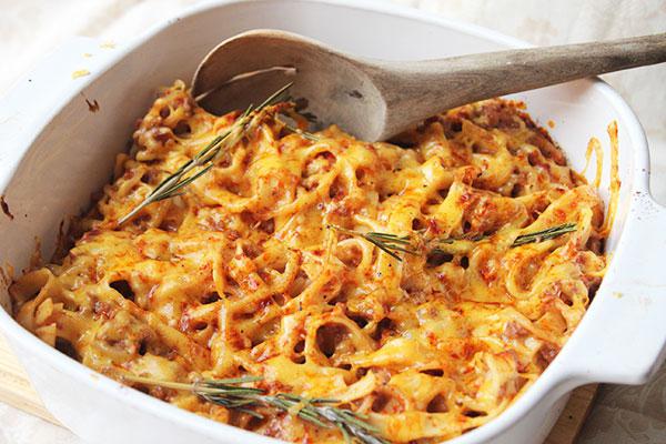 pasta with cheese and sprigs of rosemary