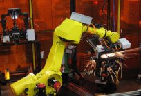 An industrial robot. Robots in the workplace. Machines-robots