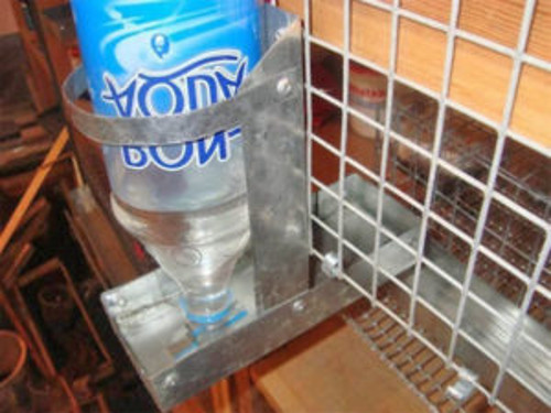 Drinker for rabbit in a metal housing