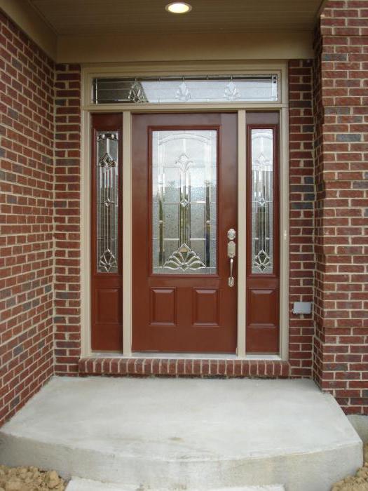 installation of metal entrance doors with their hands photo