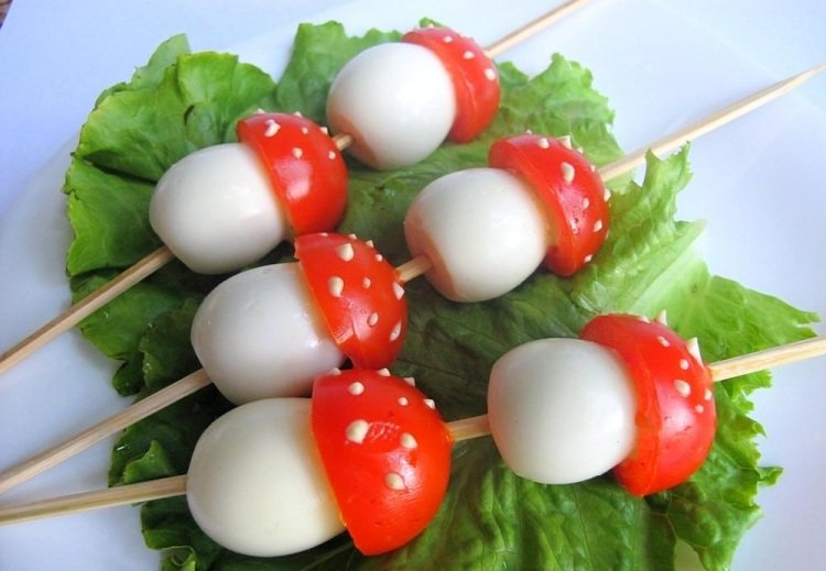 Mushrooms from eggs and tomatoes on a skewer