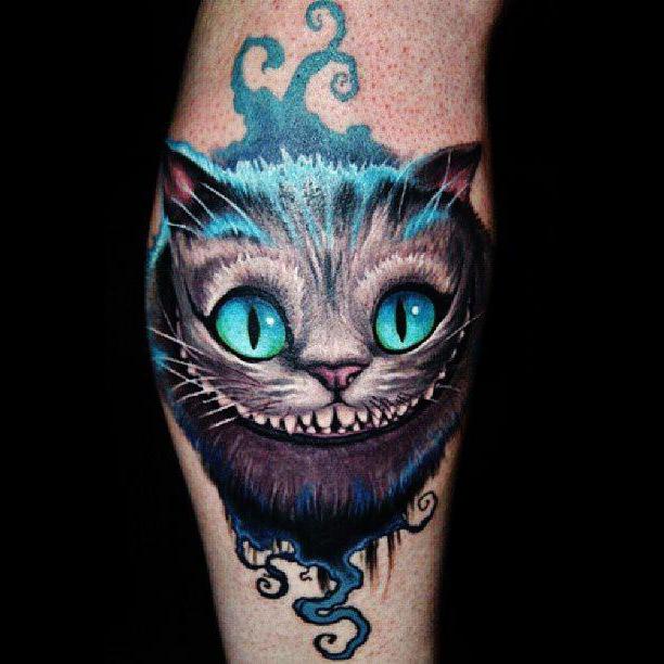 kot z cheshire tatuaż