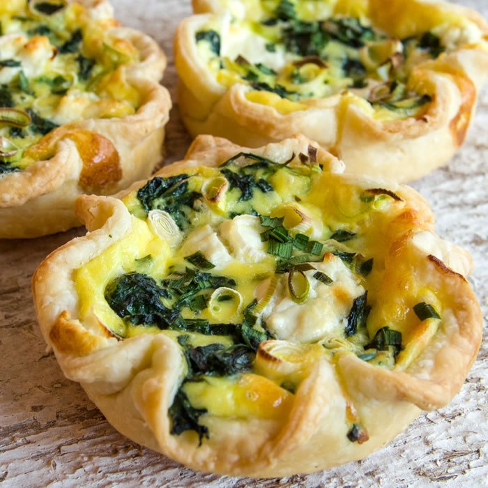 Tartlets with cheese and greens