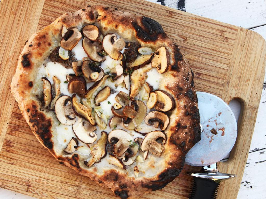 Pizza with mushrooms in the oven