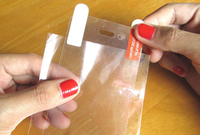 cómo pegar la cinta adhesiva en el teléfono de la foto