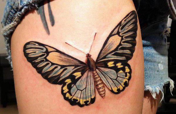 Schmetterlings-Tattoo auf dem Bein für Mädchen