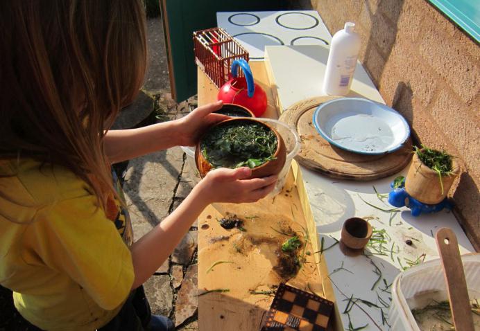 children's play kitchen with their hands