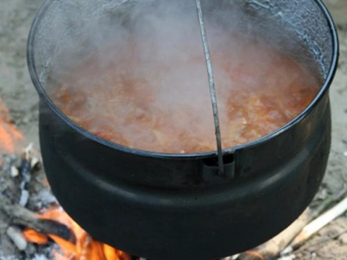 Cook the lamb in a cauldron