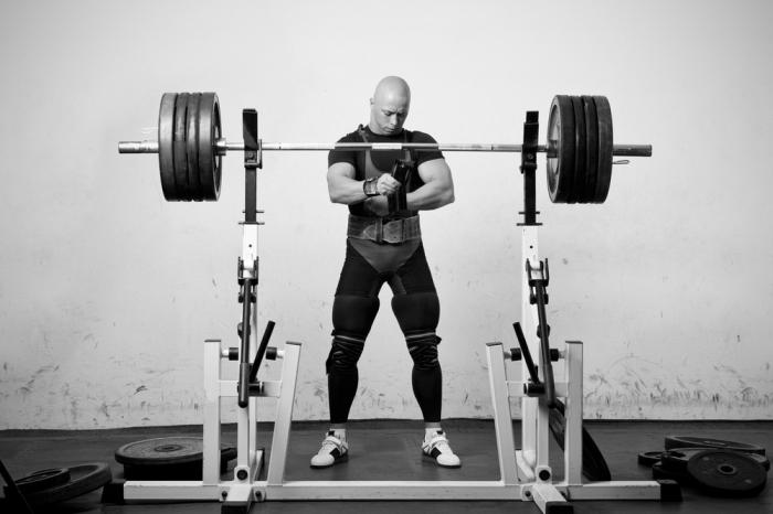squat with a barbell on his chest which muscles are working