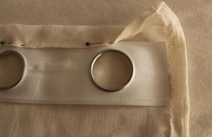 rings for curtains with their hands