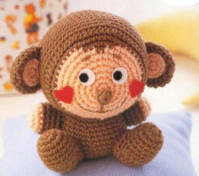 monkey amigurumi crafts with their hands