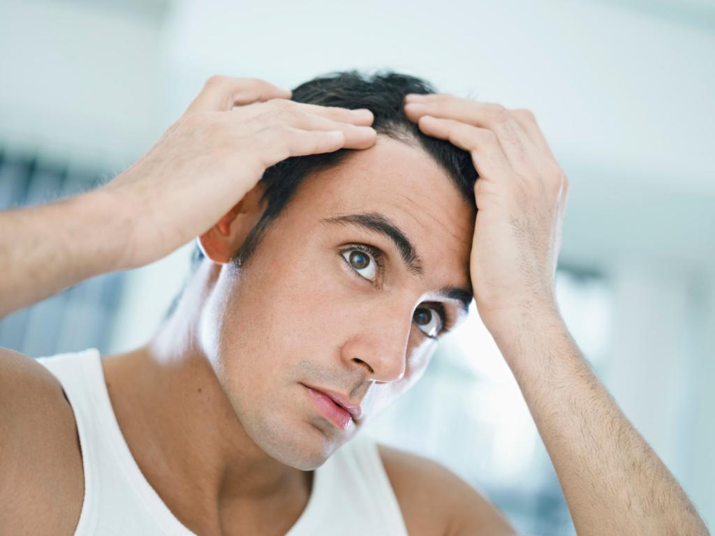 أعراض تساقط الشعر