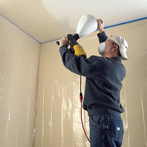 painting the ceiling with a spray gun